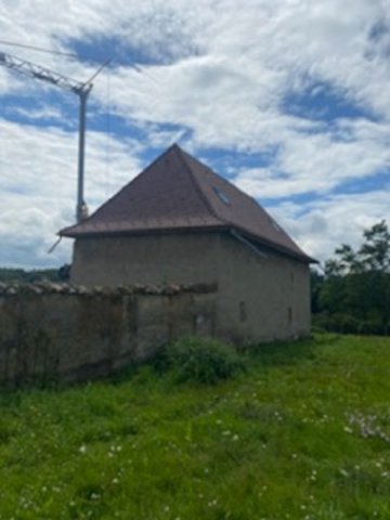 Rénovation de toiture dauphinoise avec couverture en tuile écaille vers Bourgoin-Jallieu 